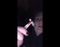 Lady uses tweezers to smoke 