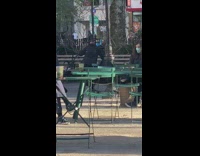 Guy balances object on head