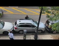 Guy tries to get out of tight parking spot 