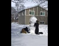 Guys build tall snowman using eight snowballs 