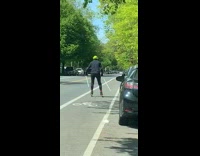 Neon green helmet guy rollerblades two sticks 