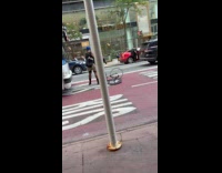 Angry cyclist blocking bus on street