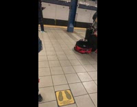 Guy plays steel drum at subway station