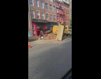 Bulldozer tipped over on its side 