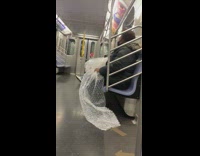 Lady on subway sits pops bubble wrap 