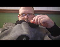 Dog loves snuggles eat fruit inside jacket