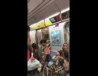 family next to flooding subway door