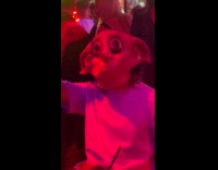 Man in bar wear Dobby mask dance