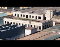 Man gets sun on the roof alone in the building at NY 