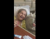 Granda in hospital reading out loud