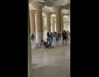 Woman fans herself while man takes picture under her