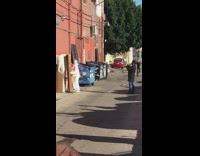 Man white hazmat suit open present alleyway