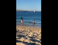 Woman violet green bikini sexy pose beach part 1