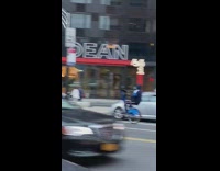 Guy blue bicycle wheelie missing front tire 