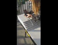 Guy films toy skateboard tricks