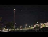 Street lights flicker at parking lot night