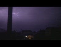 Lightning strike crawls on the cloudy night sky