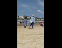 Guy black shorts beach handstand sand