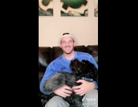 Guy does couples quiz with black dog 