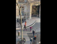 Three people dance while an old man watches them