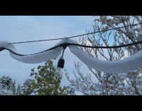 Wavy band of snow hang on wire