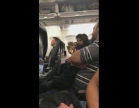 Couple woman taking selfie on airplane seated