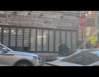 Guy wears skull mask 