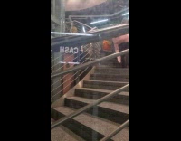 Man toilet paper costume walks on stairs