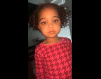 Young girl red shirt try sour gum