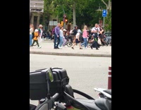 Woman white cap dances at the street