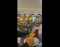 Guy drops cup at cafeteria everyone claps