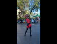 Woman waving at mrs incredible in disneyland parade asks for high five