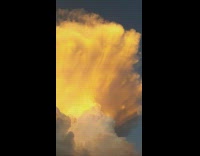 Cumulonimbus cloud with orange sunset shade house