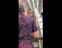 Man walks up the stairs naked at train station