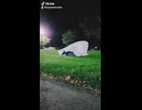 White ghost costume girl WAP dance grass