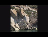 Guy jumps brown rock boat lake bikini 