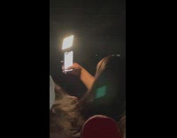 Woman selfie video light with the help of the crowd