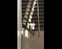 Woman white top tiktok dance airport stairs