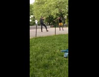 Two guys practice martial arts park 