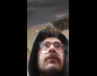 Man looks at self through front camera