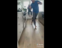 Black bulldog runs after guy, slides and hits kitchen cabinet tokyo drift song