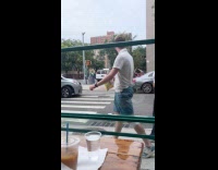 Collab WINY - Woman films homeless man dance on street