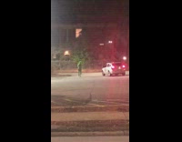 Guy green onesie  dance car red lights