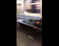 man black jacket beanie asleep on train