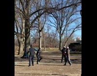 Friends throw disc cones at guy park 