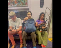 ALREADY SUBMITTED TO  WHAT IS NEW YORK - Man peeling cucumber for face mask on subway
