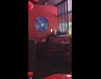 Worker cleans inside of fish tank with brush 