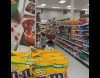Person in bear suit sits in Target shopping cart and takes pictures