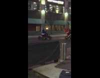 two santas on atv 4 wheelers on street