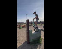 Bike Rider Jumps from One Obstacle to Another